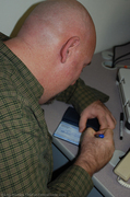 jim-writing-a-check-for-building-permit.jpg