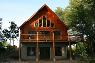 log-home-staining-applied-to-this-log-cabin.jpg