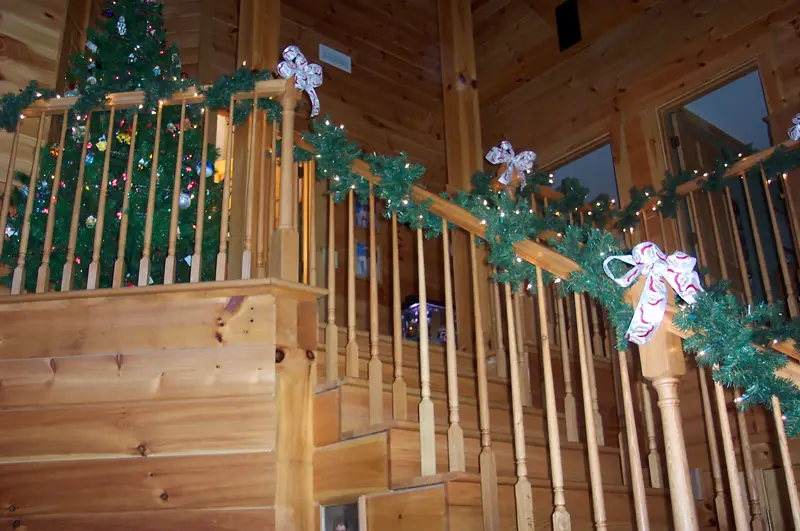 Log Cabin Homes Adorned With Holiday Lights & Christmas Decorations