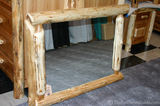 A log framed mirror from Lonesome Cottage Log Furniture Company.