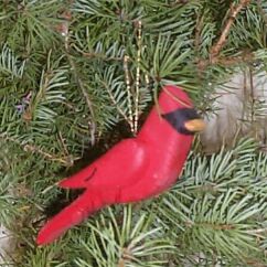 This cardinal bird ornament made of pine would add a great 'pop' of red color to the tree. red-cardinal-wooden-ornament.jpg