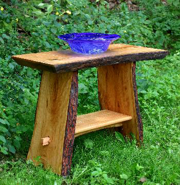 A rustic wood vanity with a cobalt blue hand-blown glass bowl. rustic-cherry-wood-vanity-with-glass-bowl.jpg