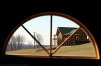 view-of-a-log-home-through-a-log-homes-window.jpg