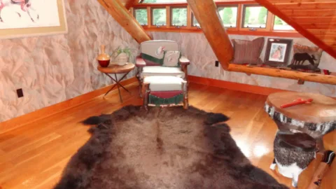 animal-skin-rug-in-log-home