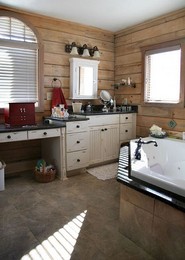 antique-white-cabinets-tile-floor-tile-tub.jpeg