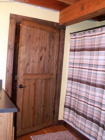 bathroom-door-in-timber-frame-home.jpg