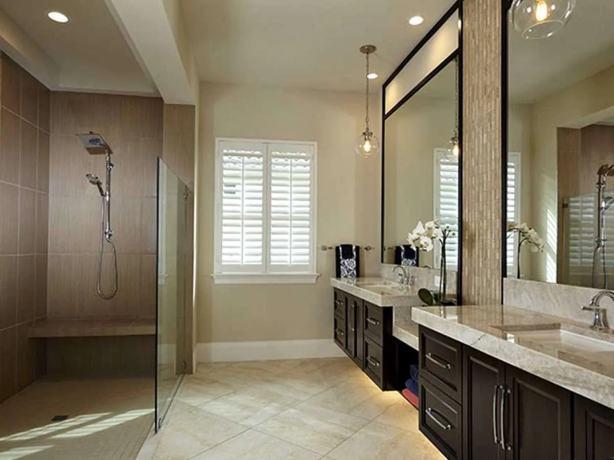 This is a nice example of a doorless shower with a short glass wall in the master bathroom -- as seen in a home for sale.