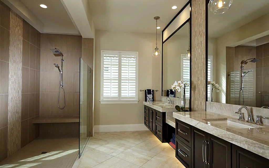 This is a nice example of a doorless shower with a short glass wall in the master bathroom.