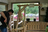 The Garden line of porch swings sold by Rocky Top Log Furniture & Railing.