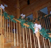 garland-laced-stairs-in-log-home.jpg