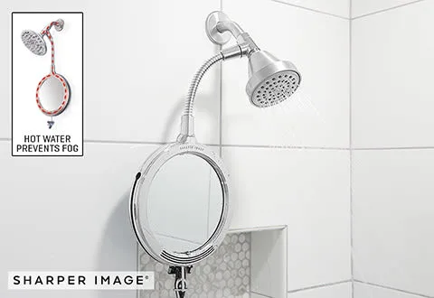 This mirror from Sharper Image gets "warmed" from a trickle of shower water that is diverted from the main shower stream -- so that it's sprayed onto the mirror and then exits the mirror bottom directly to the shower floor. 