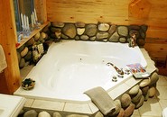 jacuzzi-tub-surrounded-by-stones.jpg