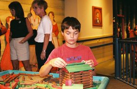 kid-building-lincoln-logs-cabin-by-Caomai.jpg