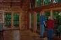 A log home living room with lots of windows!