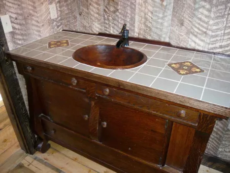 A rustic bathroom vanity with copper sink. photo by JBColorado on Flickr