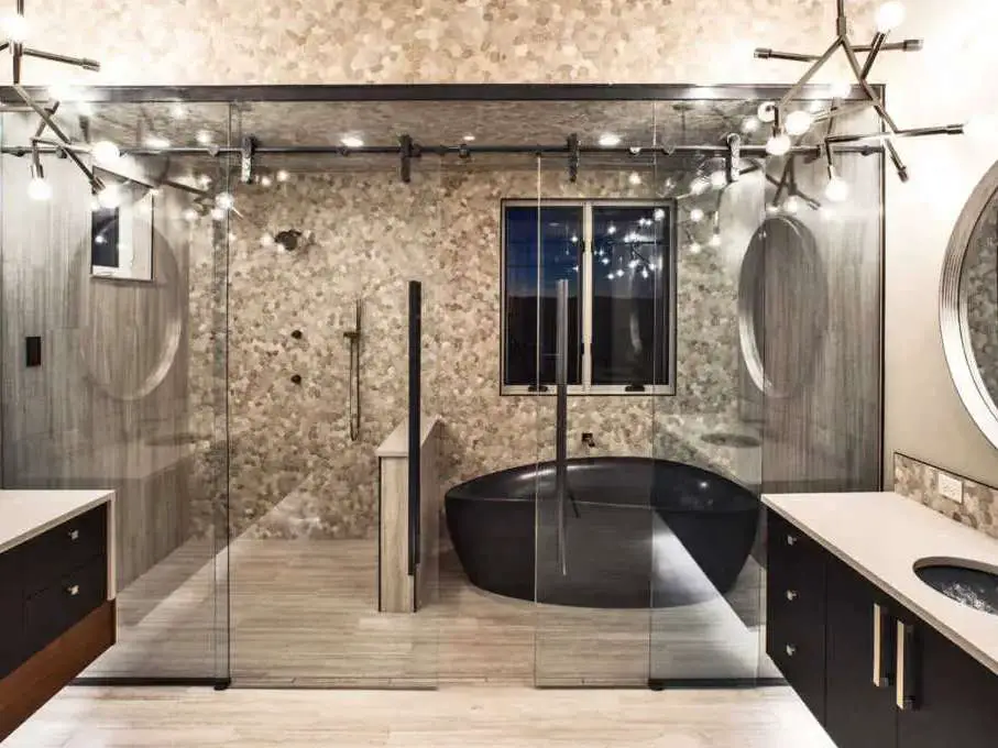 A master bathroom wet area - the walk-in shower and bathtub are both enclosed in a glass 'room' -- as seen in a collection of master bathrooms.