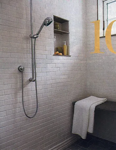 A nice spa shower inside the master bathroom -- with a built-in shower seat and niche shelf for hair products.