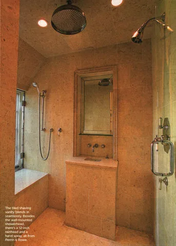 A small sink with a fogless mirror for shaving and brushing teeth in the shower.