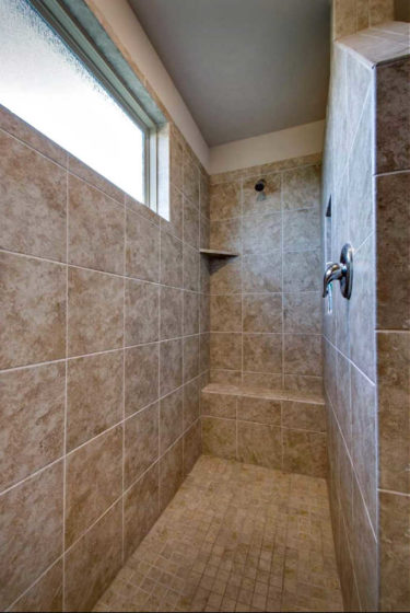 Another tiled walk-in shower without a door - as seen when touring homes for sale.